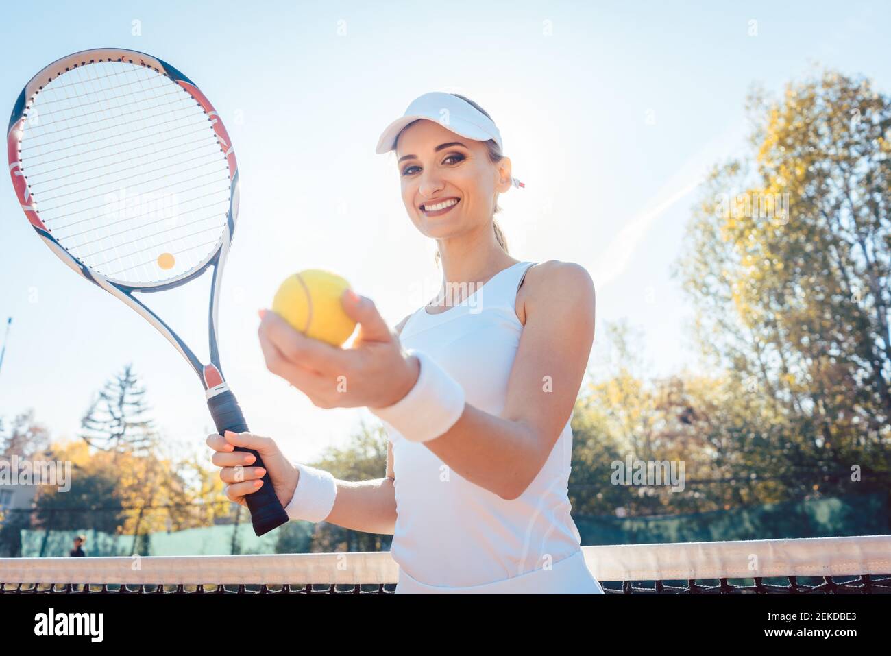 Beautiful woman getting ready to play tennis Stock Photo
