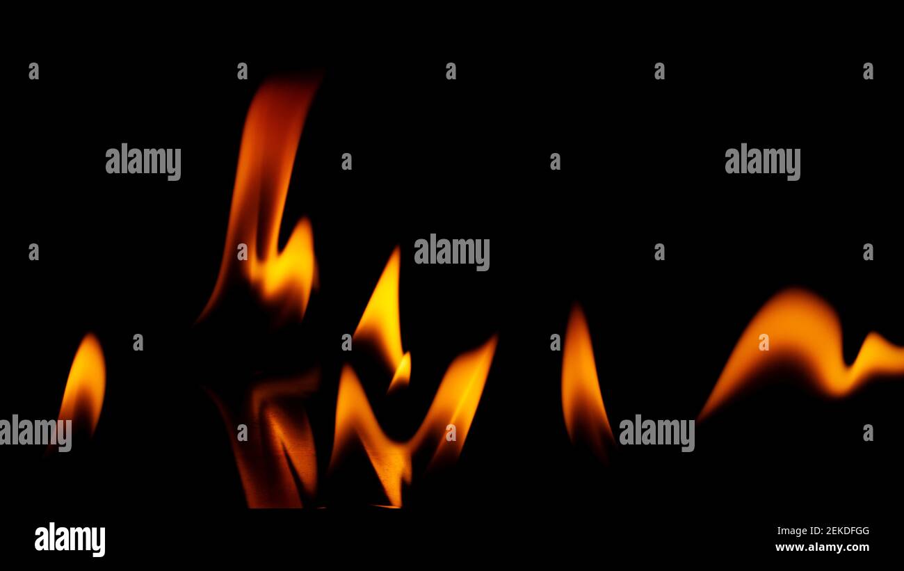Fire flames isolated on a black background Stock Photo - Alamy