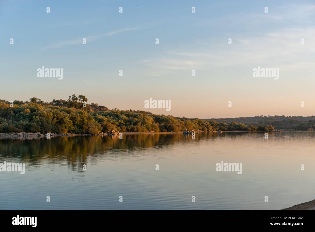 Landscape with lake reflection at sunset of Nisa Dam in Alentejo, Portugal Stock Photo