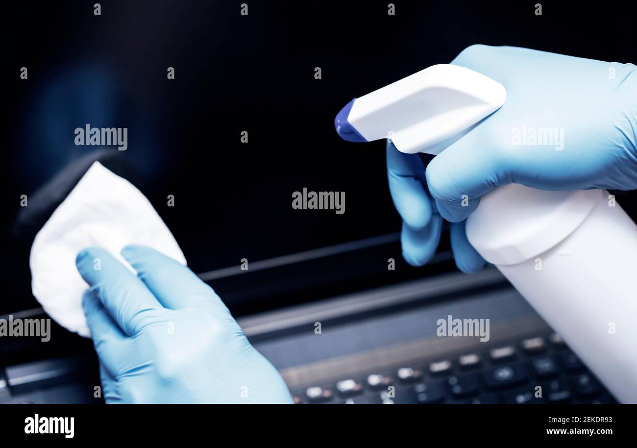 Coronavirus COVID19 sanitize cleaning disinfection of work desk.Office