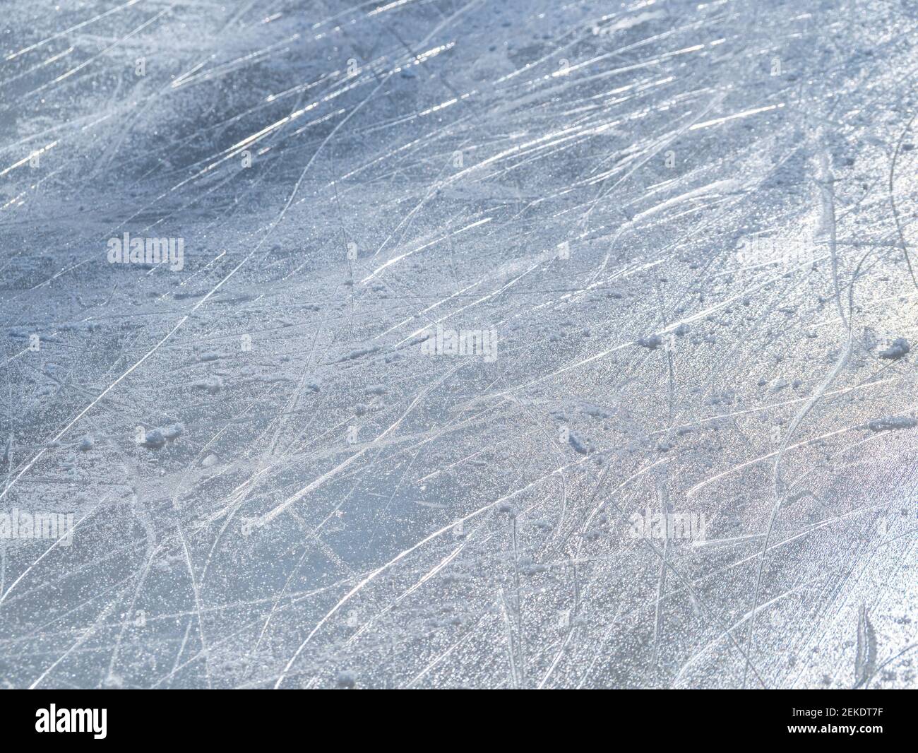 Ice rink surface texture with scratches from the ice skates Stock Photo