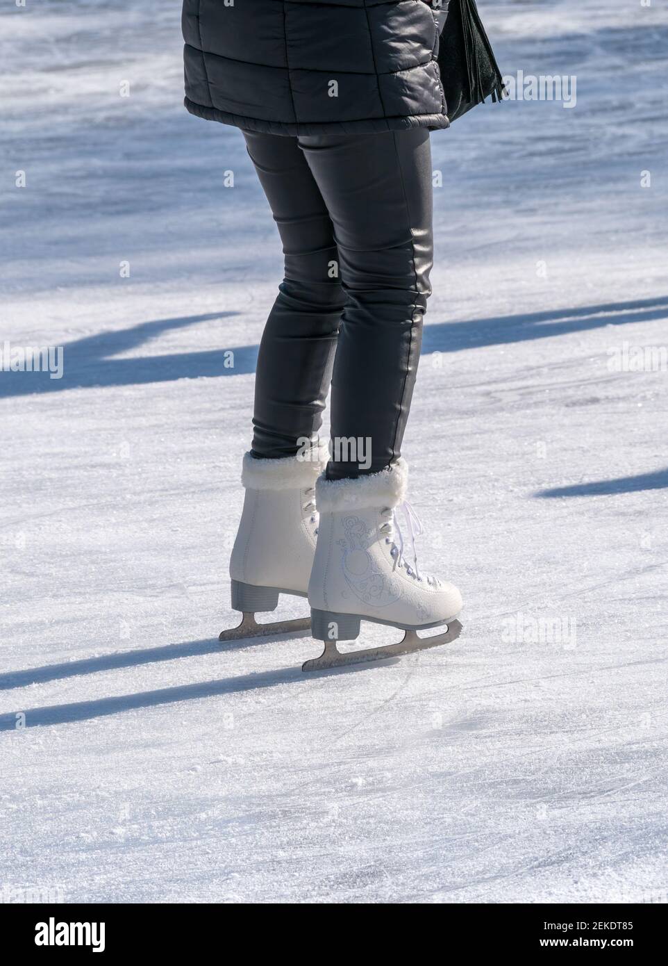 Woman with black leather pants and white ice skates on the ice rink. Woman  ice skating Stock Photo - Alamy