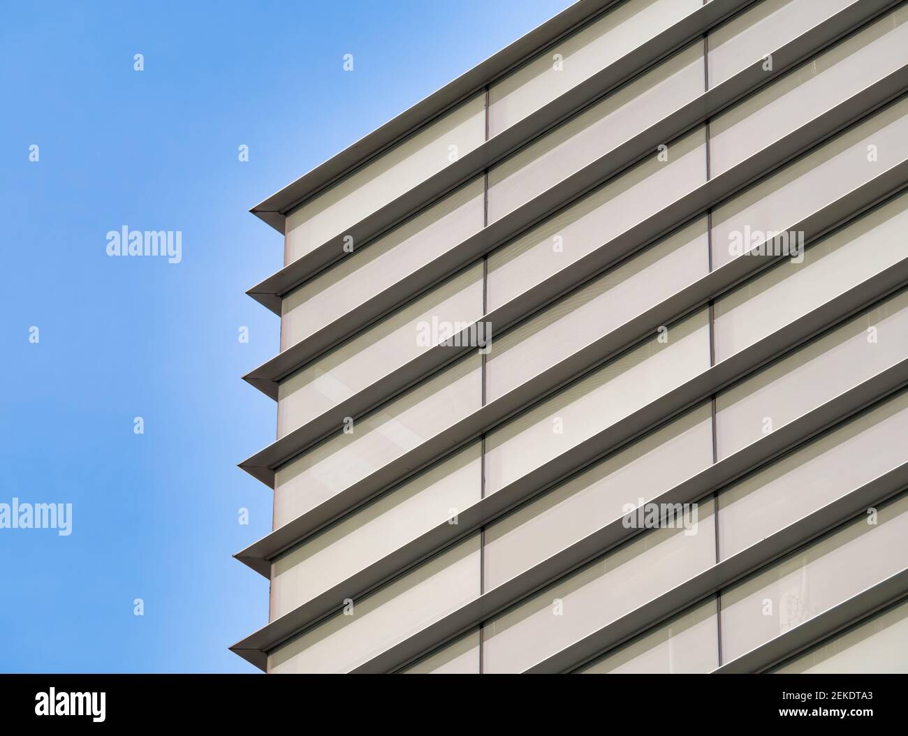 Modern glass office building against the clear blue sky Stock Photo - Alamy