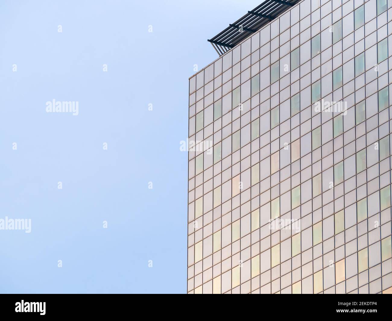 Modern glass office building against the clear blue sky Stock Photo - Alamy