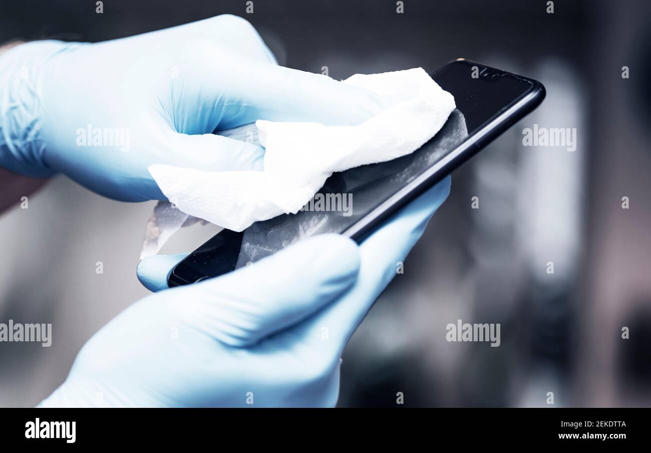 Coronavirus COVID19 sanitize cleaning disinfection of smartphone