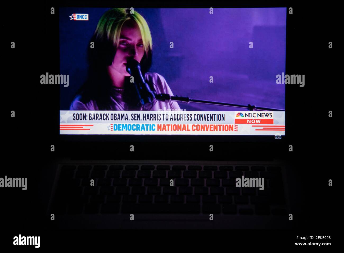A photo illustration of a laptop computer screen shows musician Billie