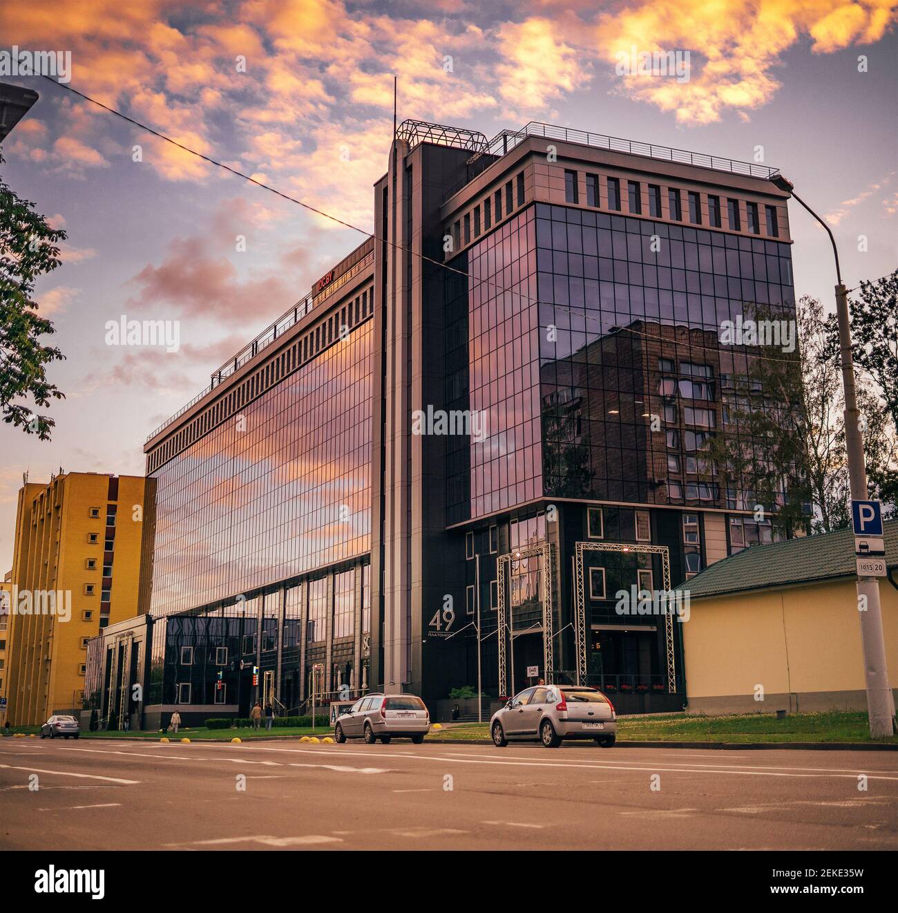 Sunset building windows mirrors urban city business center Stock Photo