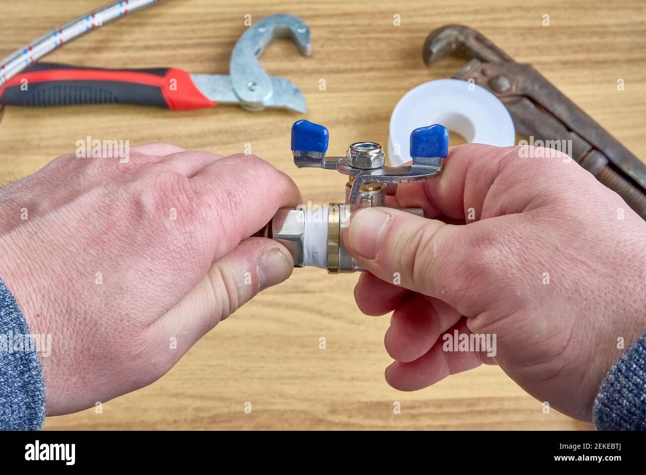 DIY repair, keys, tape reel hose ball valve Stock Photo Alamy