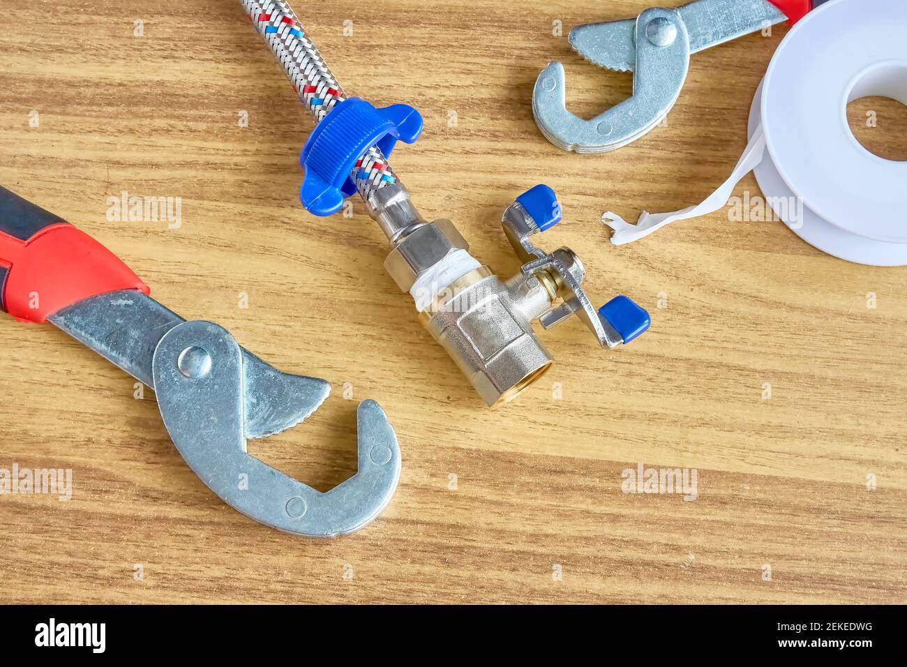 DIY repair, keys, tape reel hose ball valve Stock Photo Alamy