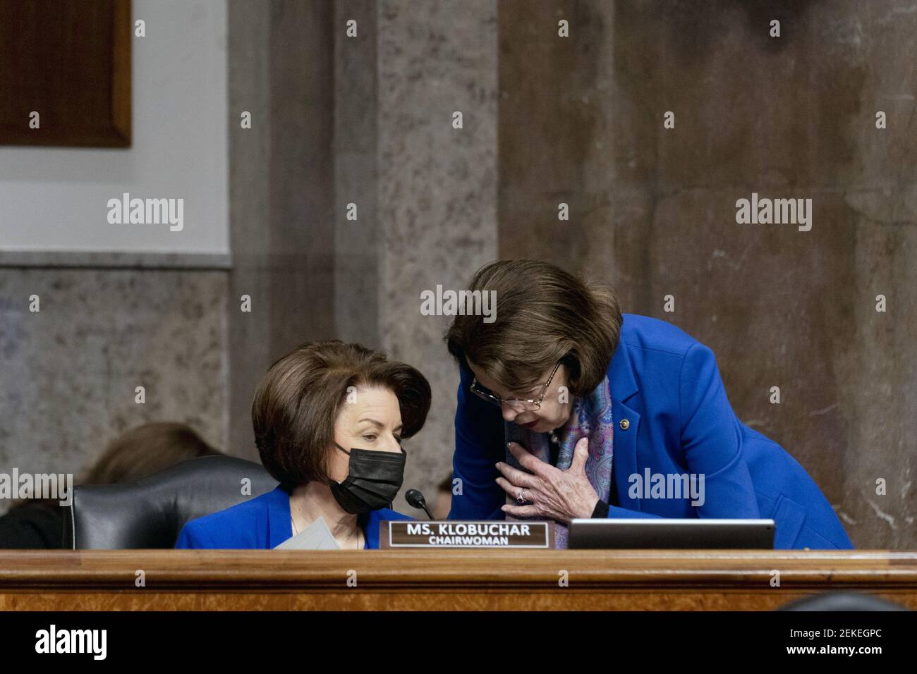 Washington, United States. 23rd Feb, 2021. Chairwoman Amy Klobuchar, D-Minn., speaks with Sen. Dianne Feinstein, D-Calif., during a Senate Homeland Security and Governmental Affairs & Senate Rules and Administration joint hearing on Capitol Hill, Washington, DC on Tuesday, February 23, 2021, to examine the January 6th attack on the Capitol. Pool Photo by Andrew Harnik/UPI Credit: UPI/Alamy Live News Stock Photo