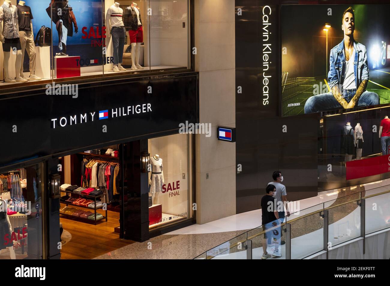 American clothing fashion brand Tommy Hilfiger store and fashion brand Calvin Klein Jeans seen at a shopping mall in Hong Kong. (Photo by Budrul Chukrut / Images/Sipa USA