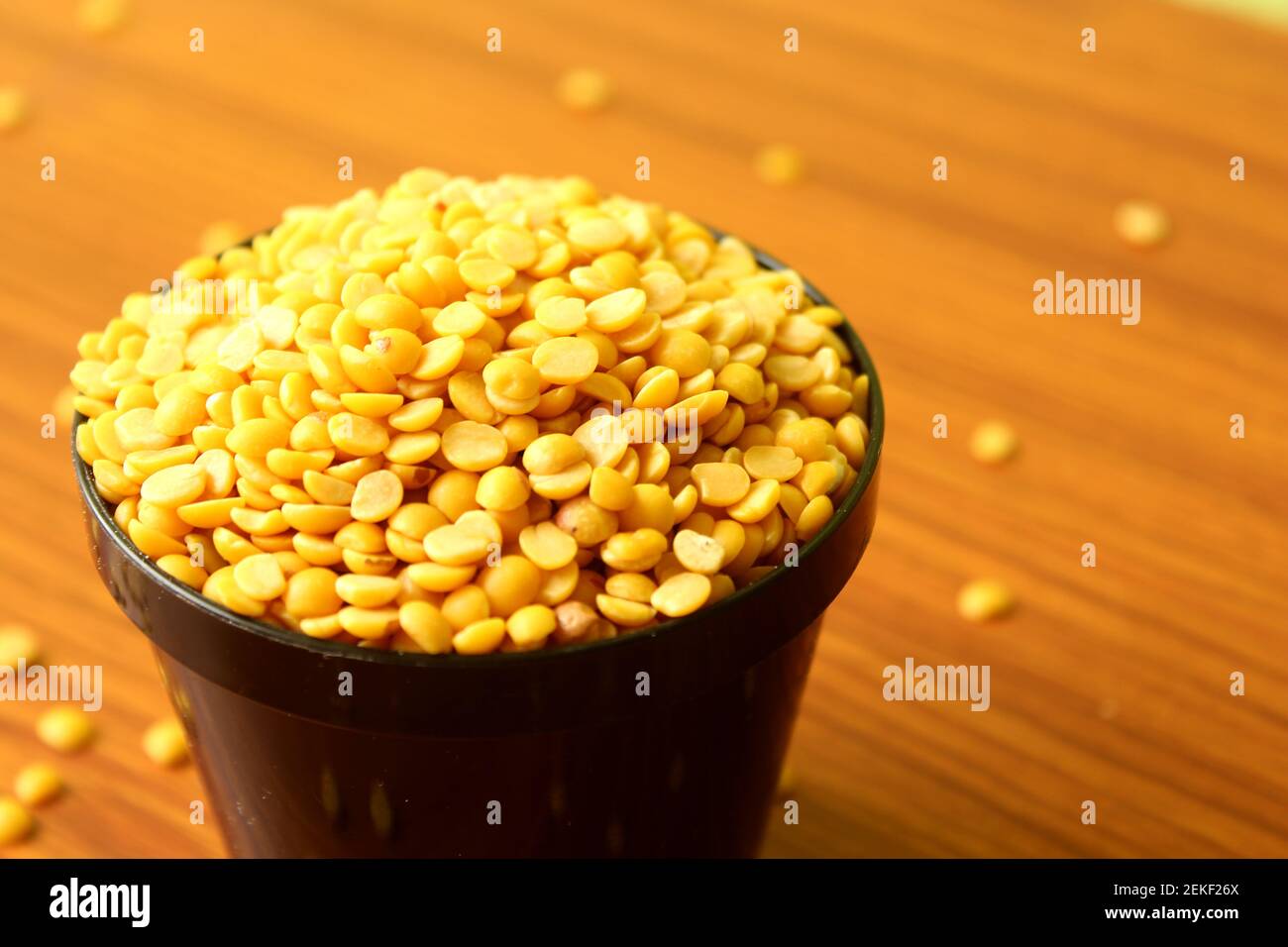 split pigeon peas ( Arhar Dal ) Organic Toor Dal in black Bowl