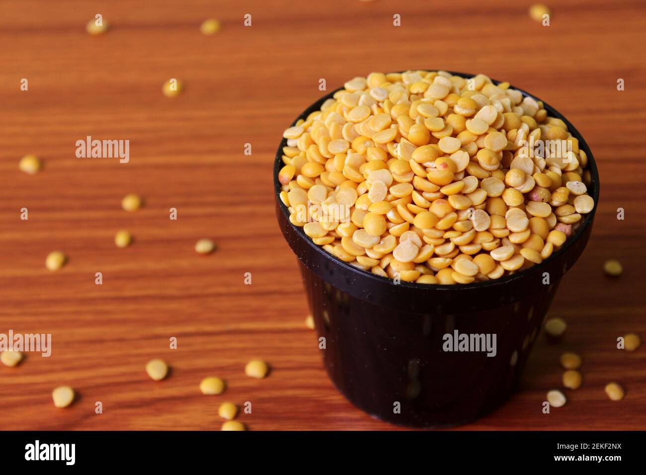 split pigeon peas ( Arhar Dal ) Organic Toor Dal in black Bowl