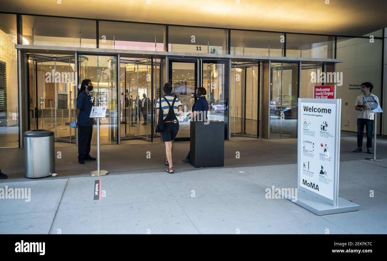 Visitors and members checkin prior to entering the Museum of Modern Art in New York on Thursday