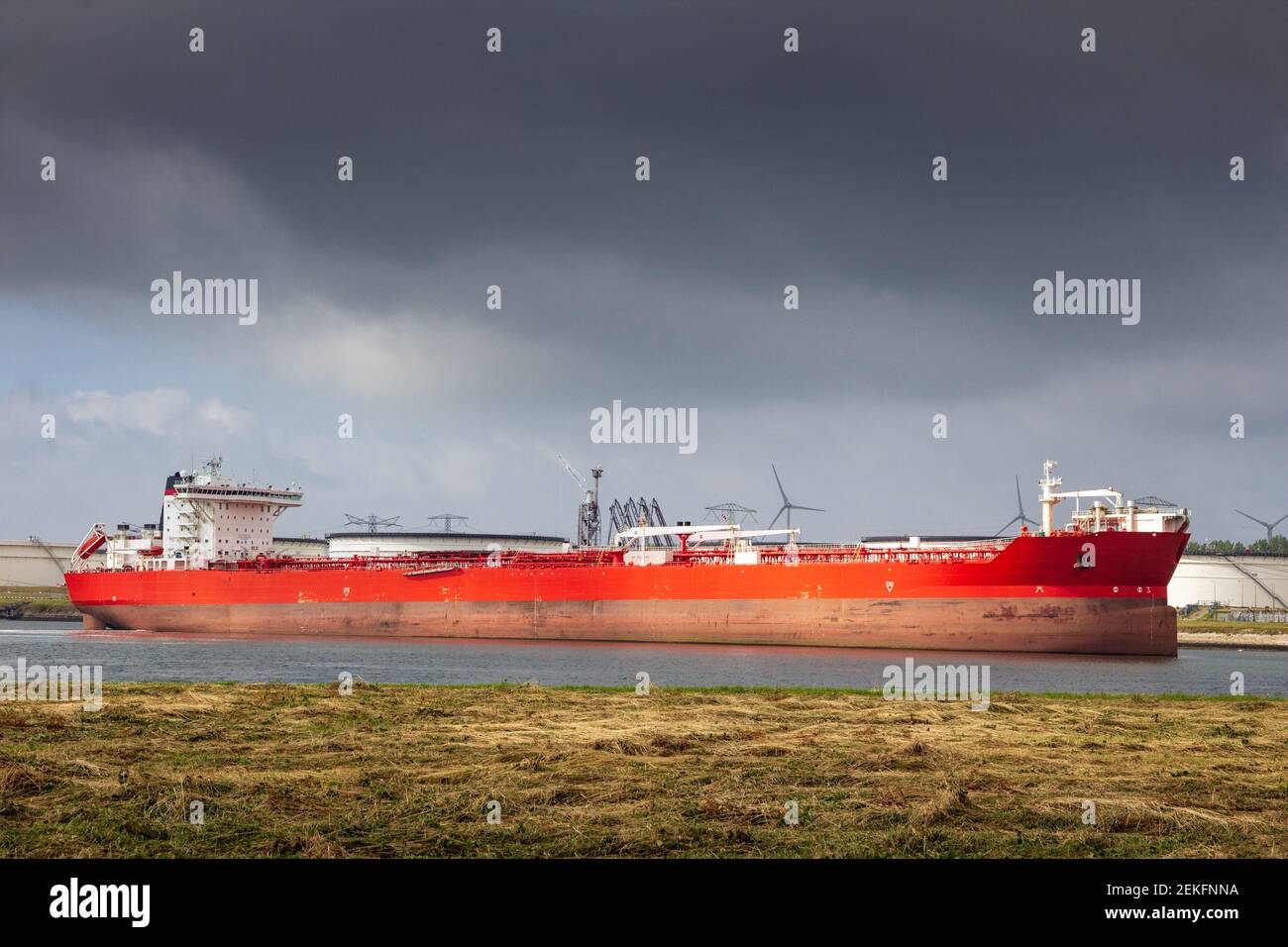 Red oil tanker moored an oil terminal in the Port of Rotterdam Stock Photo