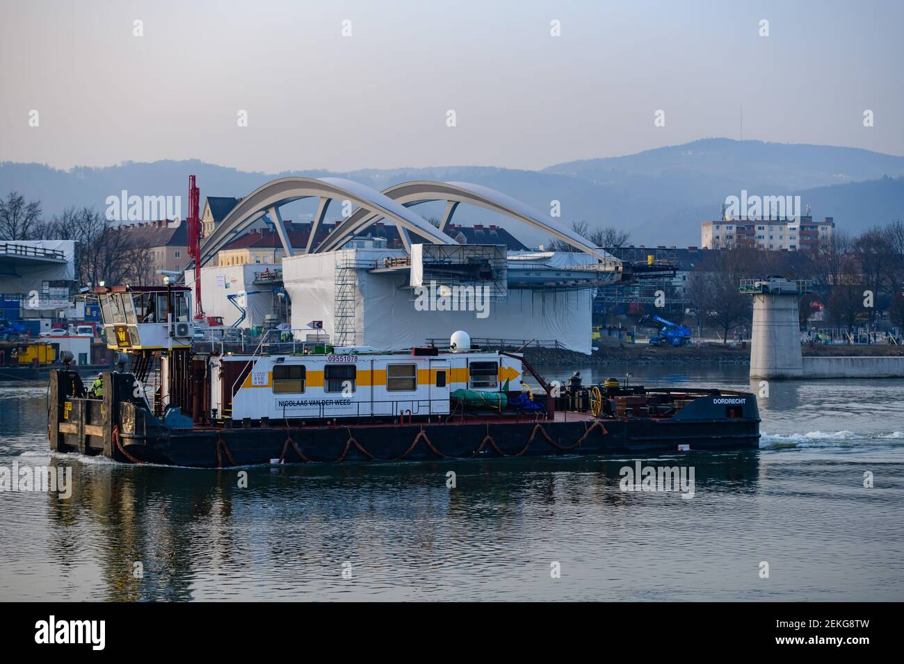 linz, austria, 23 feb 2021, mounting of a danube bridge by using ...