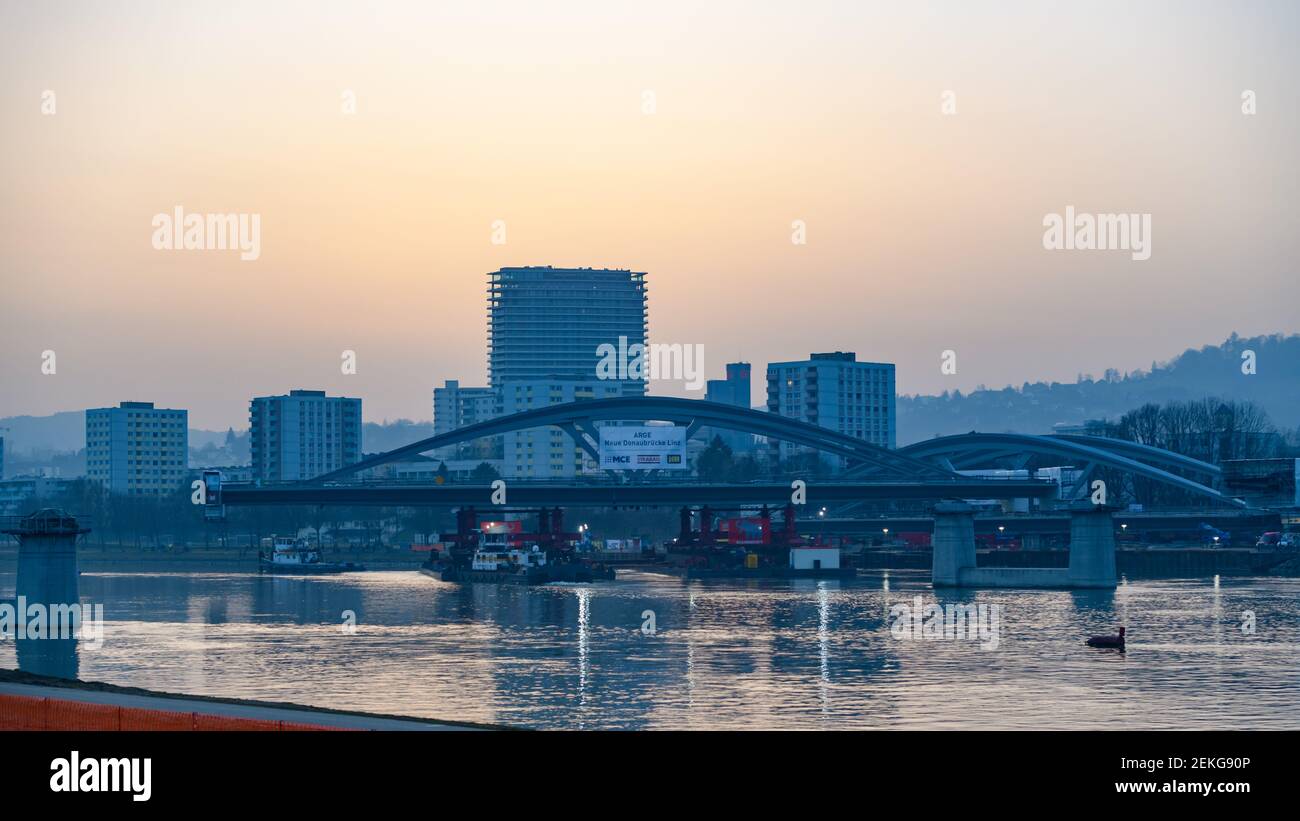 linz, austria, 23 feb 2021, mounting of a danube bridge by using ...