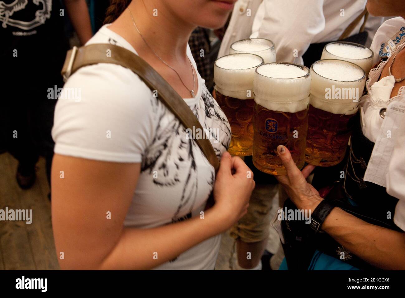 Munich, Germany Close-up of beer being held by an woman at Octoberfest (Oktoberfest)  on the Theresienwiese. Stock Photo