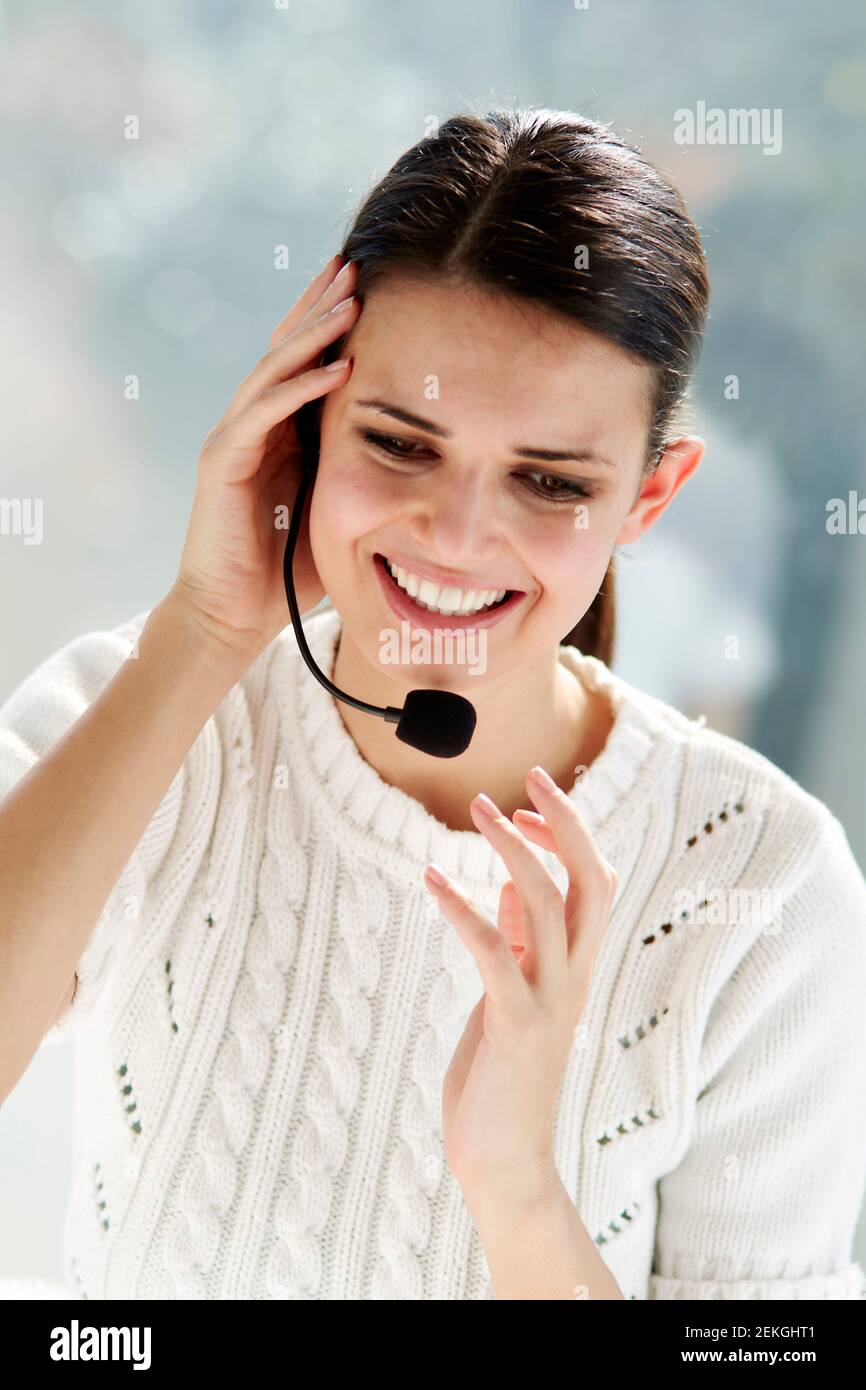 Woman talking wearing a headset Stock Photo