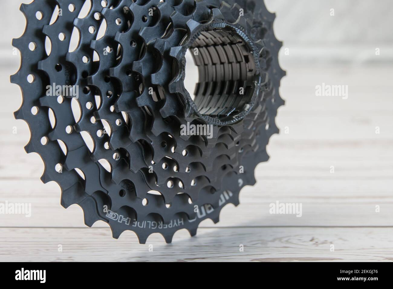 Krasnodar, Russia - February 12, 2021: The new black Shimano bike cassette stands with its teeth on the boards Stock Photo