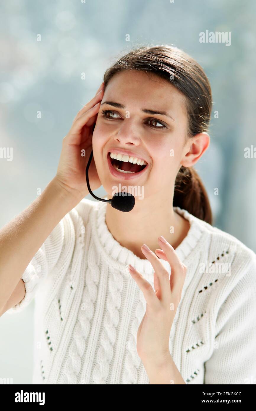 Woman talking wearing a headset Stock Photo