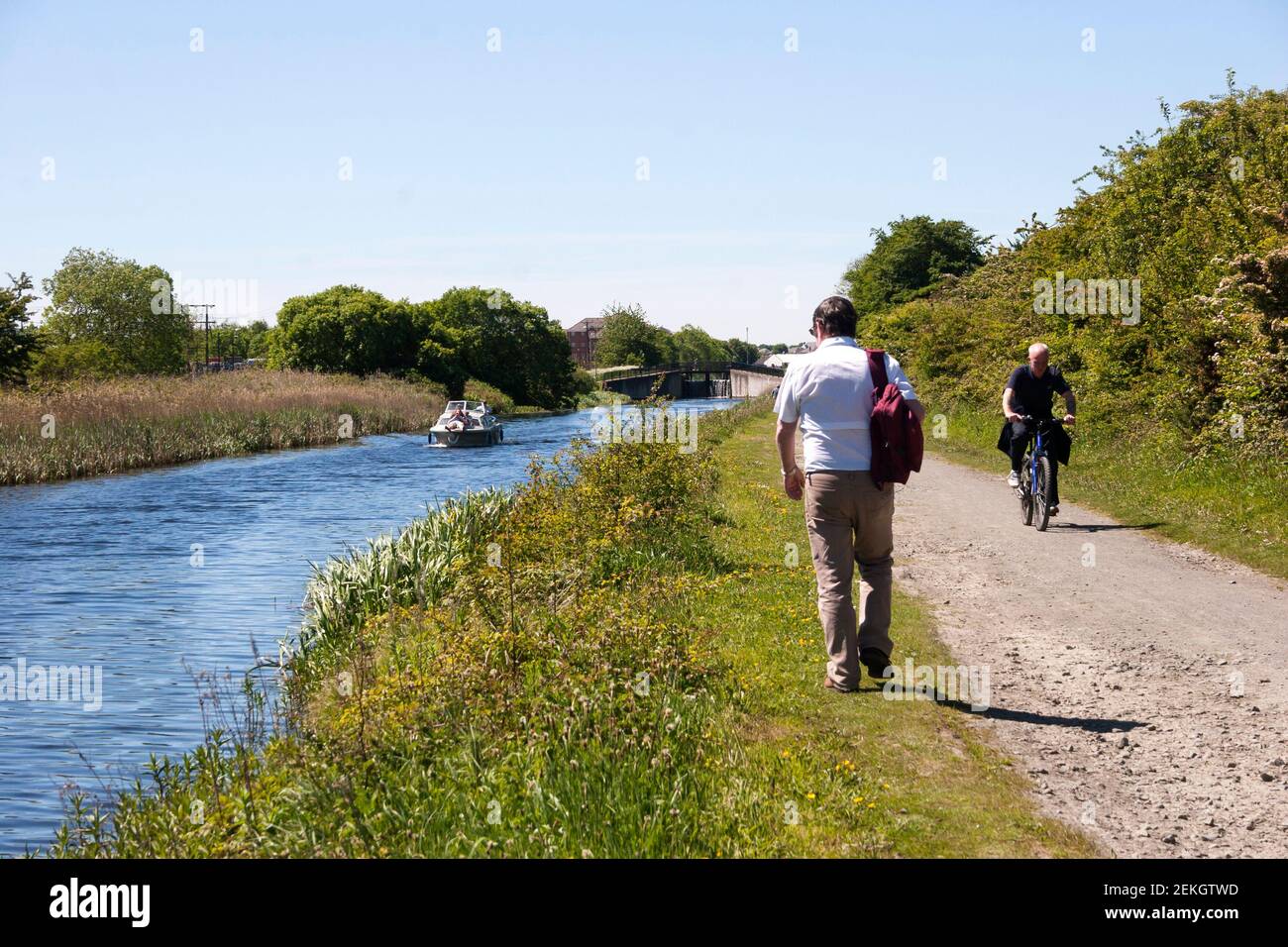 Forth and Clyde Canal nr Falkirk with people on the towpath and small boat. Stock Photo