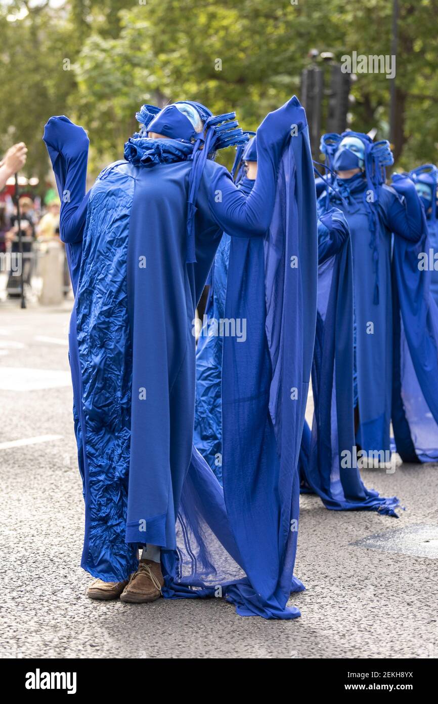 Protesters wear blue outfits to represent the ocean during the demonstration. The groups of Extinction Rebellion Marine, Ocean Rebellion, Sea Life Extinction and Animal Rebellion marched in London in a ‘socially distanced grief march’ to demand protection for the oceans and in protest against global governmental inaction to save the seas due to climate breakdown and human interference, and the loss of lives, homes and livelihoods from rising sea levels. (Photo by Dave Rushen / SOPA Images/Sipa USA)  Stock Photo