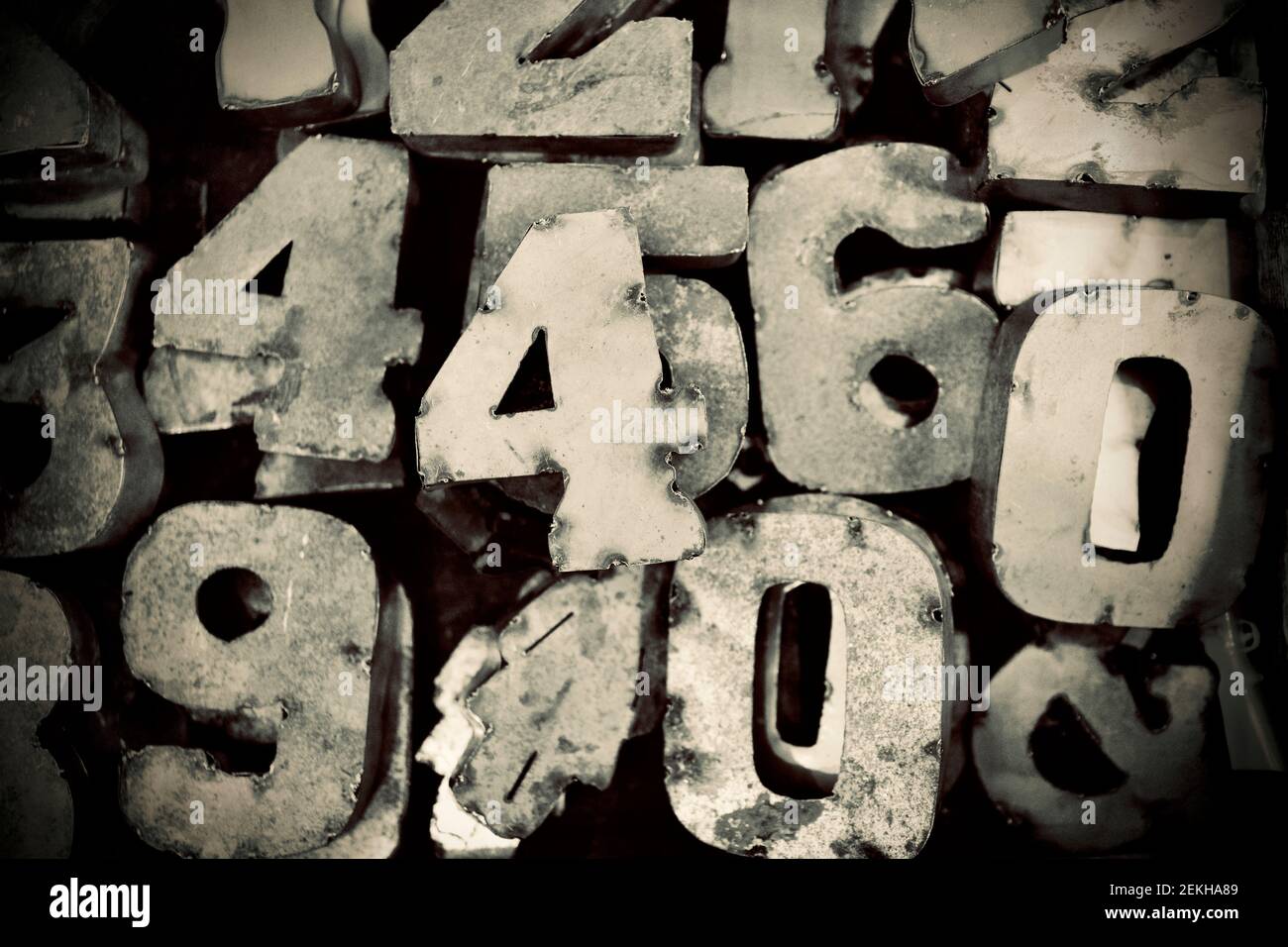 Collection of antique metal numbers in conceptual photograph. Stock Photo