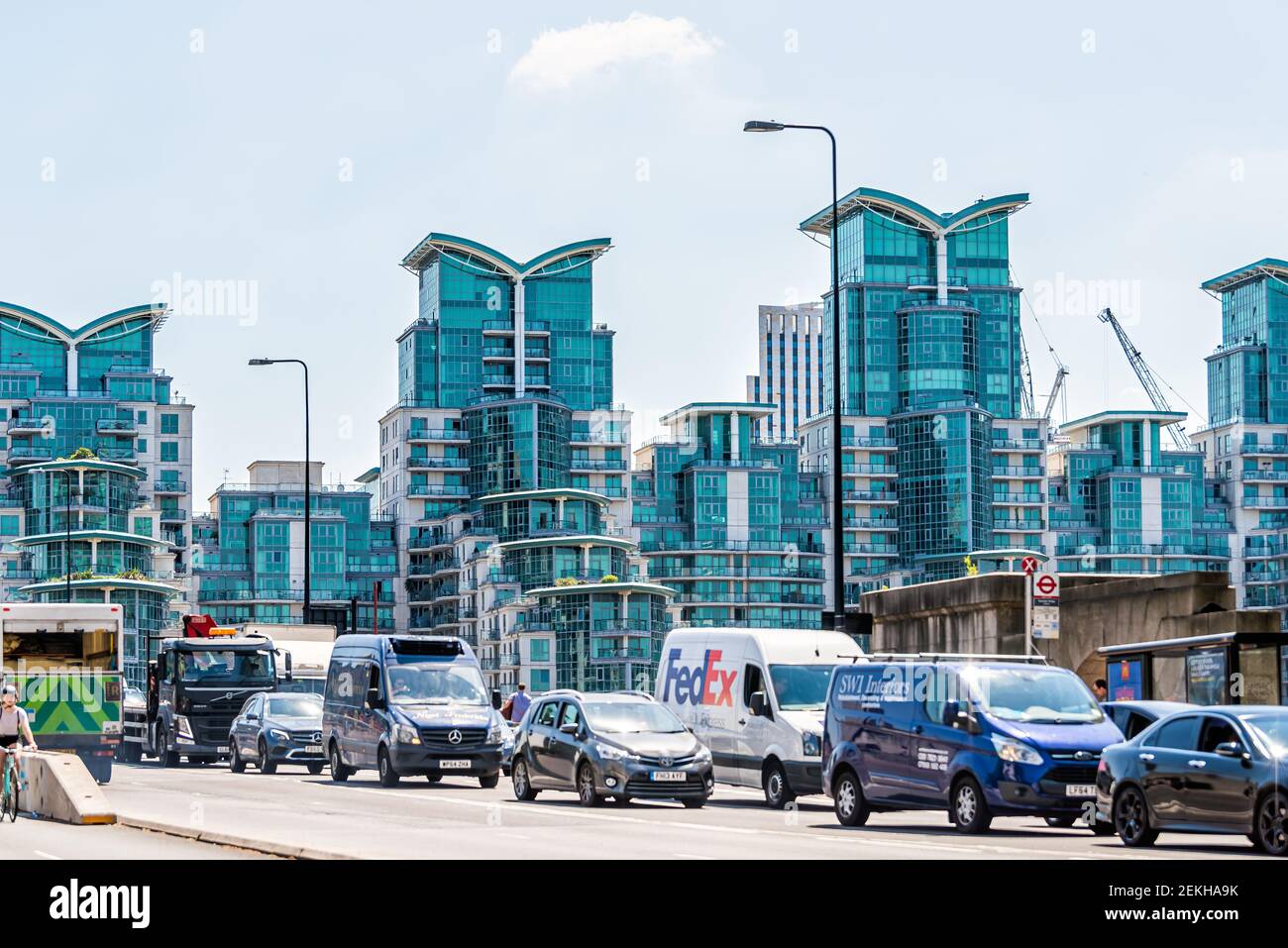 London, UK - June 24, 2018: Thames River Vauxhall bridge with modern glass apartment St George's buildings and cars on road in summer Stock Photo