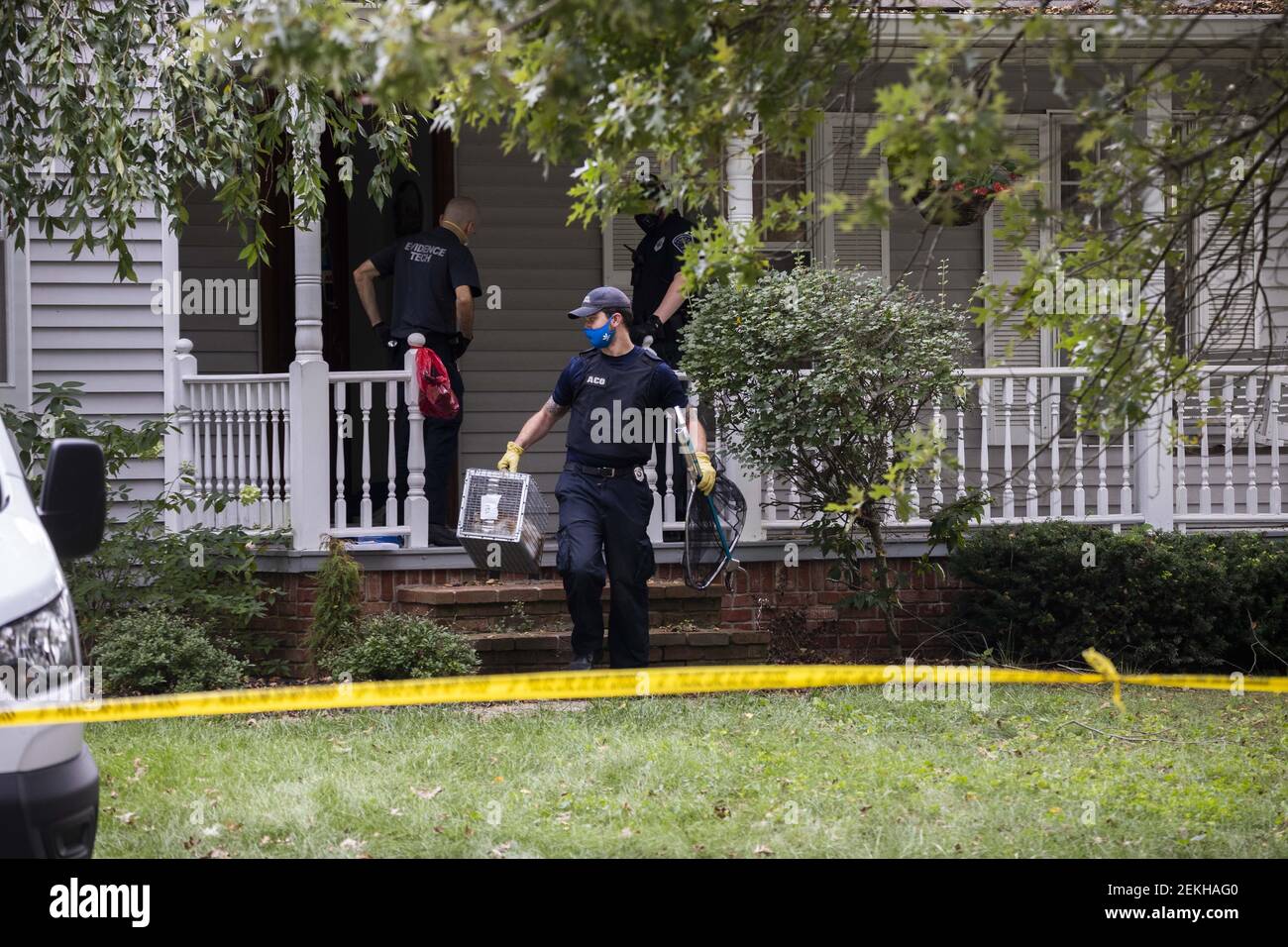 A cat is taken to the animal shelter as police investigate a triple murder-suicide that left four community members dead at a home in the 2600 block of S. Olcott Blvd., in A cat is taken to the animal shelter as police investigate a triple murder-suicide that left four community members dead at a home in the 2600 block of S. Olcott Blvd., in