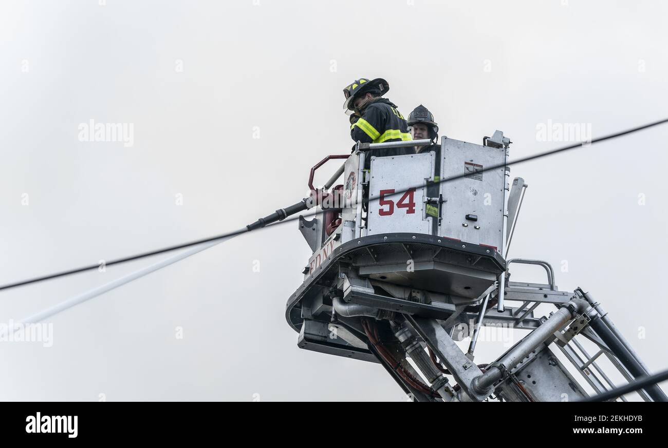 Firefighters battle massive salvage yard 4 alarm fire in the Bronx