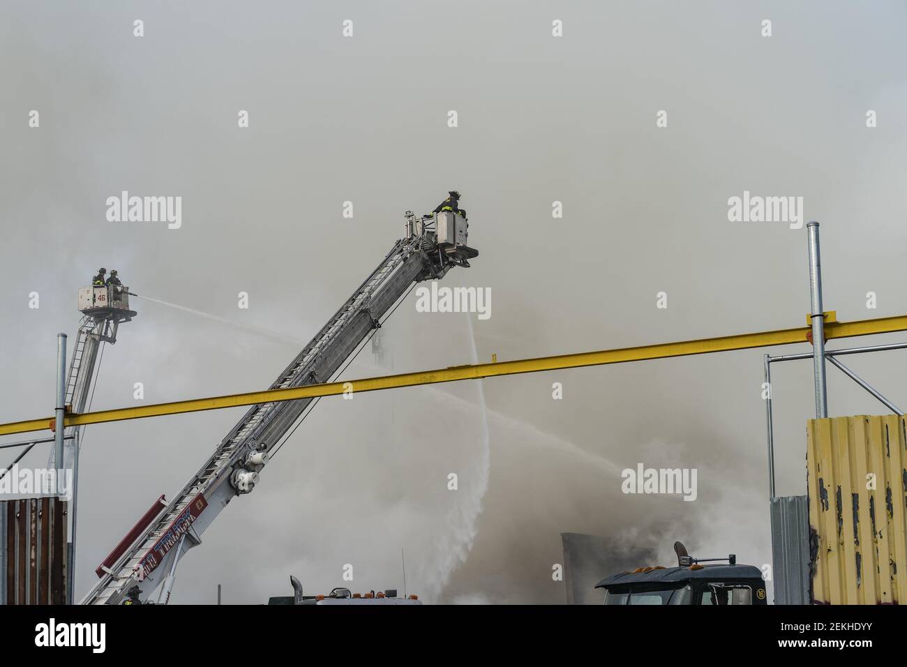 Firefighters battle massive salvage yard 4 alarm fire in the Bronx