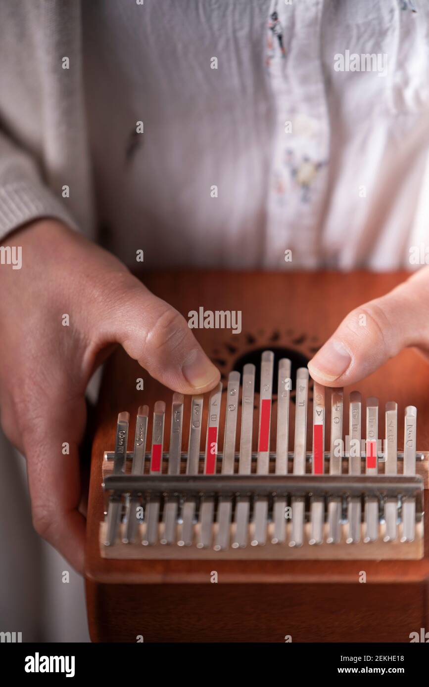 woman's hands playing the kalimba Stock Photo Alamy