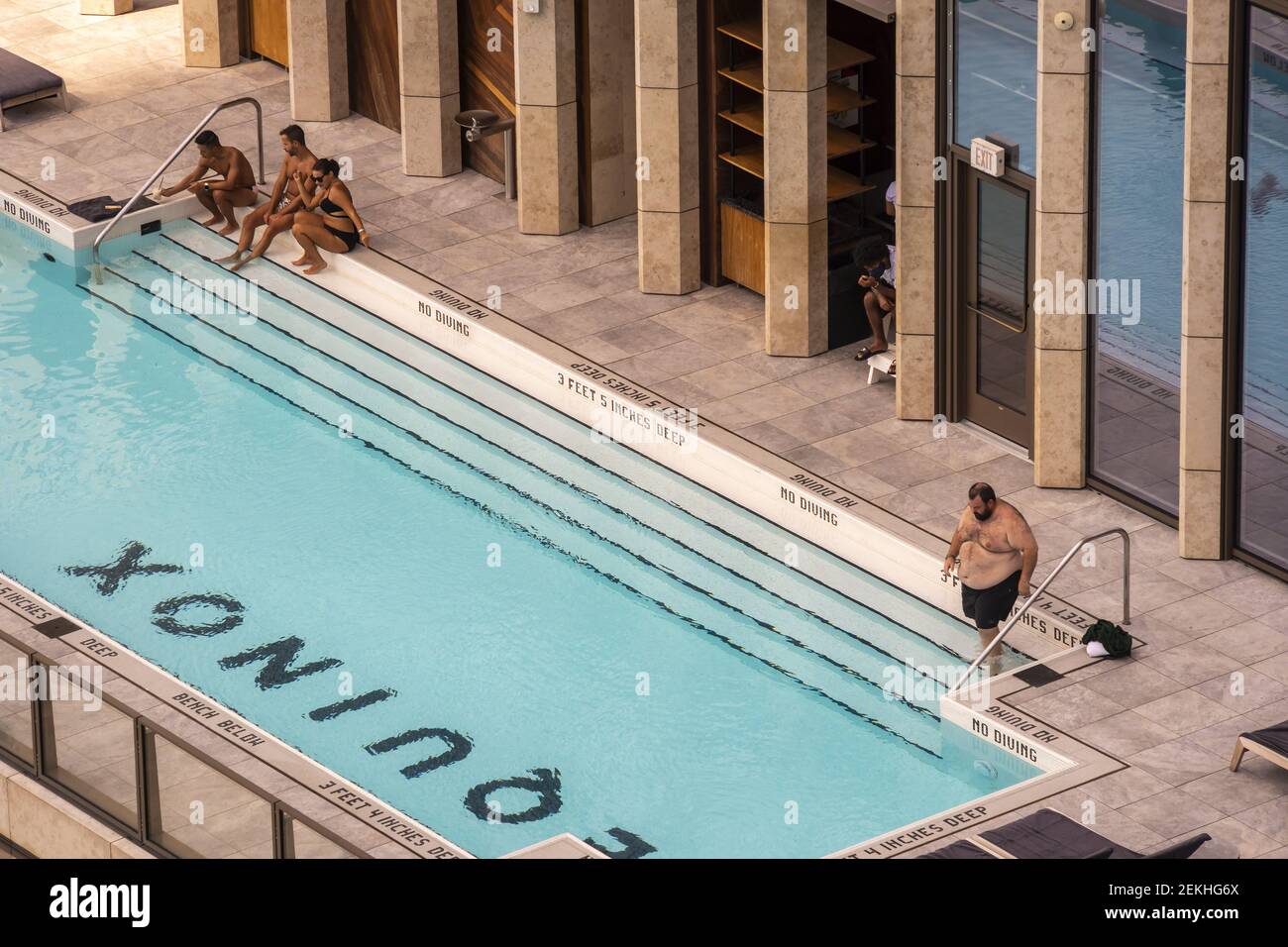 Members Enjoy Sunbathing And The Pool At The Equinox Sports Club In members-enjoy-sunbathing-and-the-pool-at-the-equinox-sports-club-in