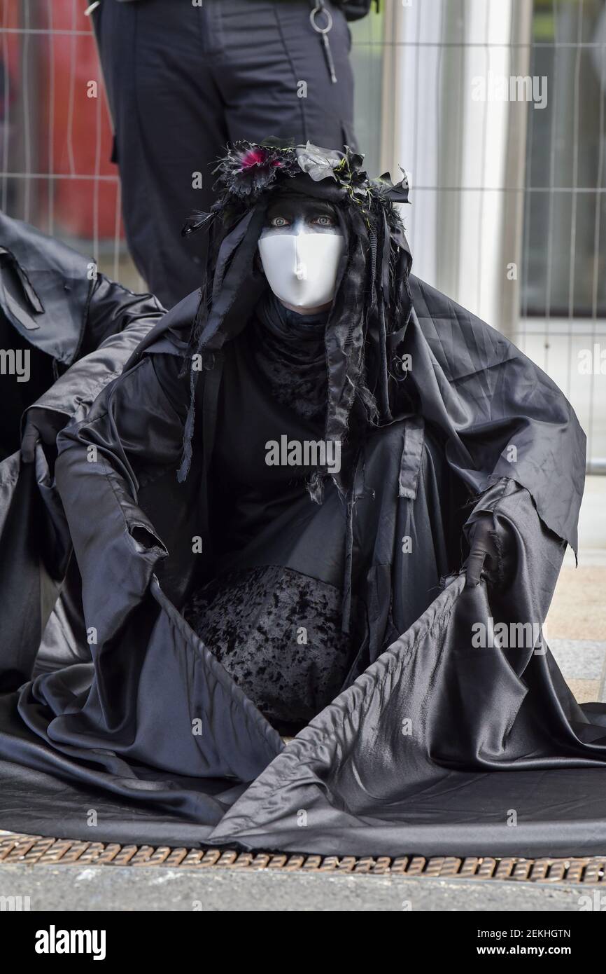 Member of the Black Brigade seen during the performance. Extinction ...