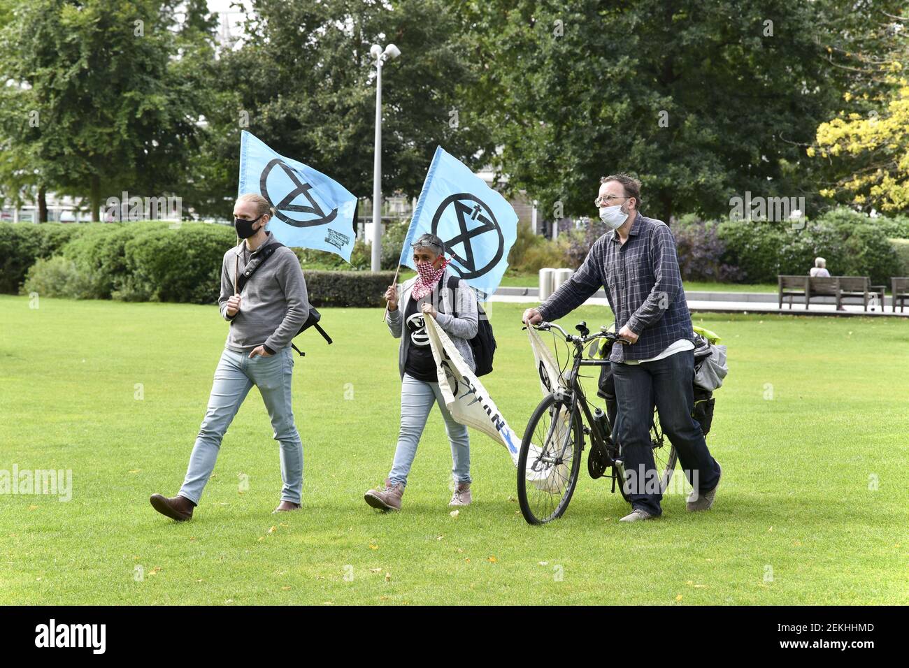 Extinction Rebellion protesters wearing facemask are seen walking with ...