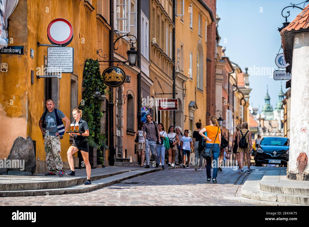 Warsaw, Poland - August 23, 2018: Old town historic city during summer day with cobbled cobblestone narrow back street alley ul Piwna and stores shops Stock Photo