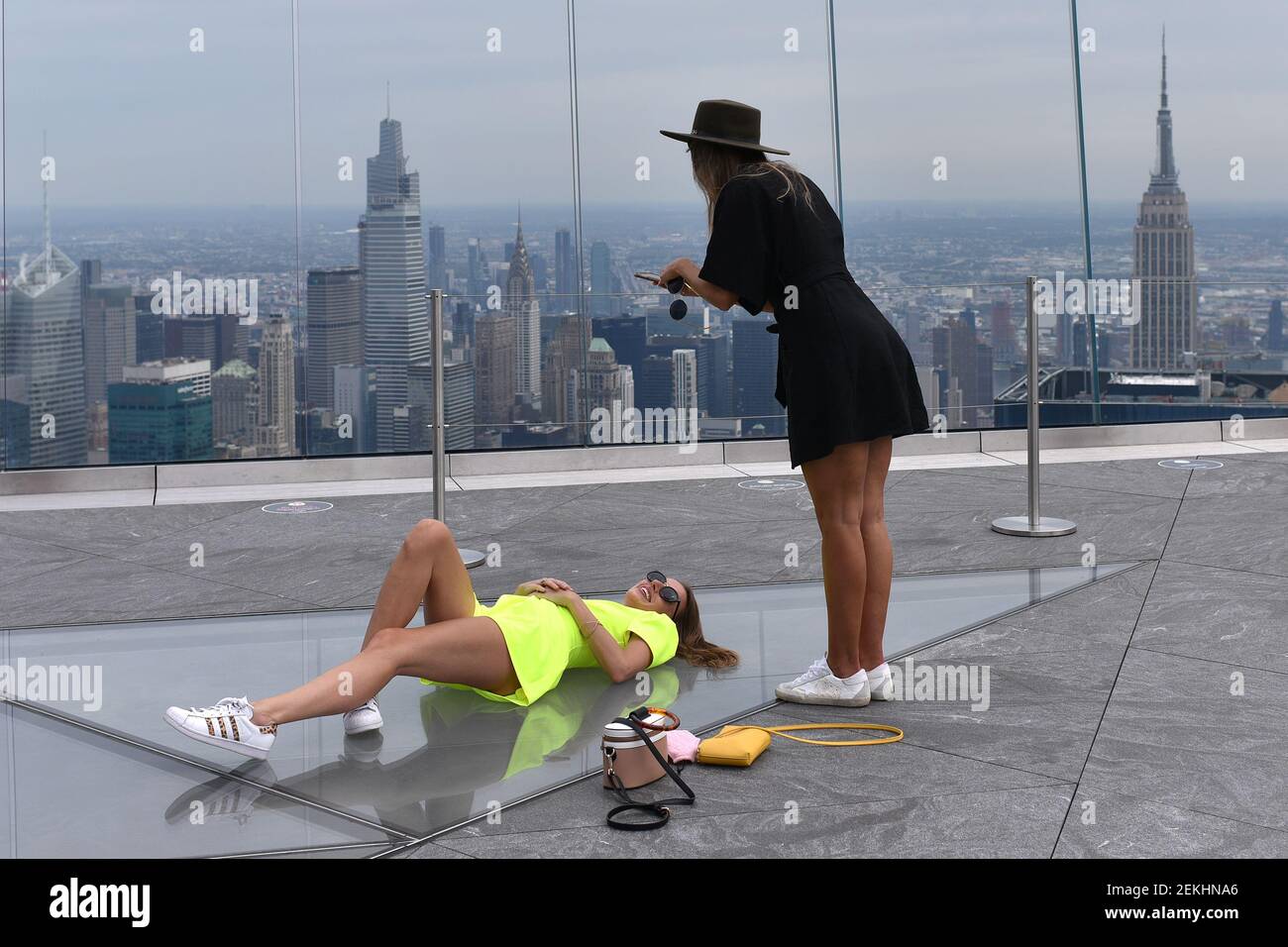 Kelsey Riggs uses a cell phone to take a photo of her Kelsey Riggs as ...