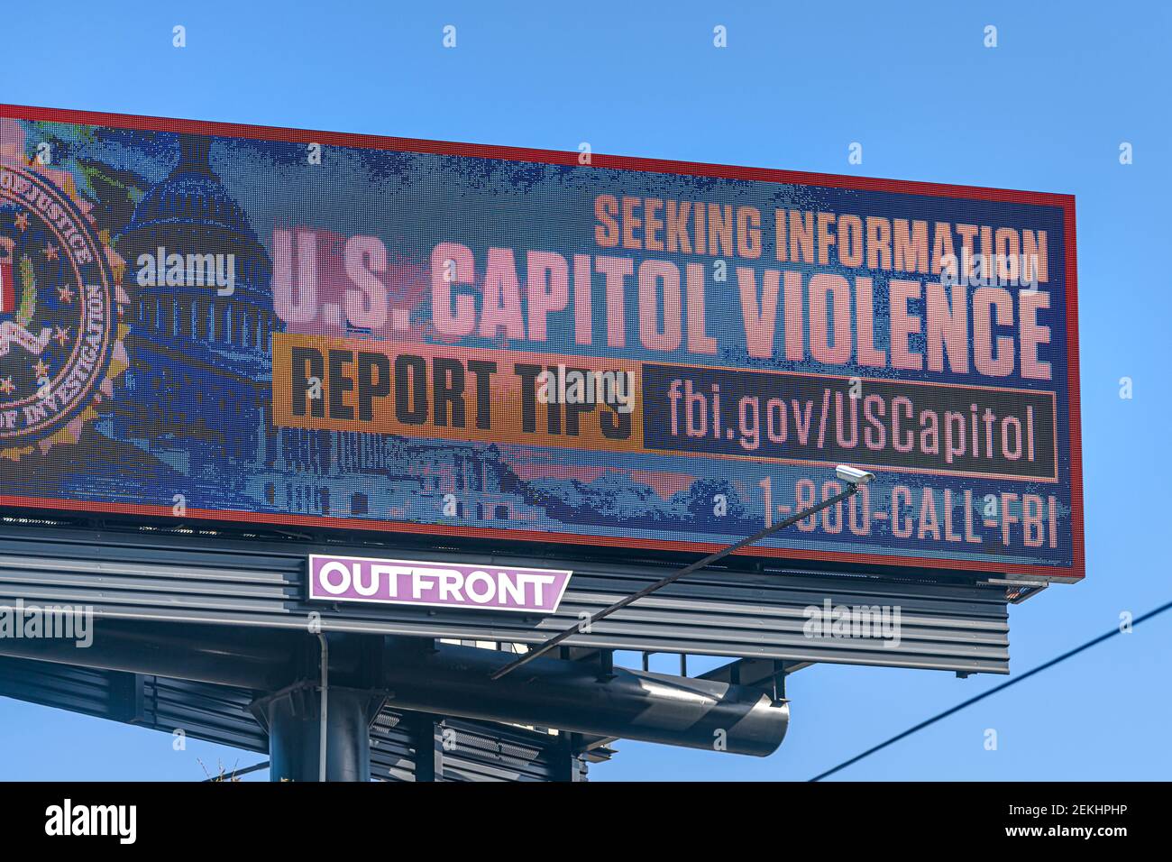 Orlando, USA - January 16, 2021: Florida highway road sign text for seeking information on US capitol violence from fbi department of justice Stock Photo