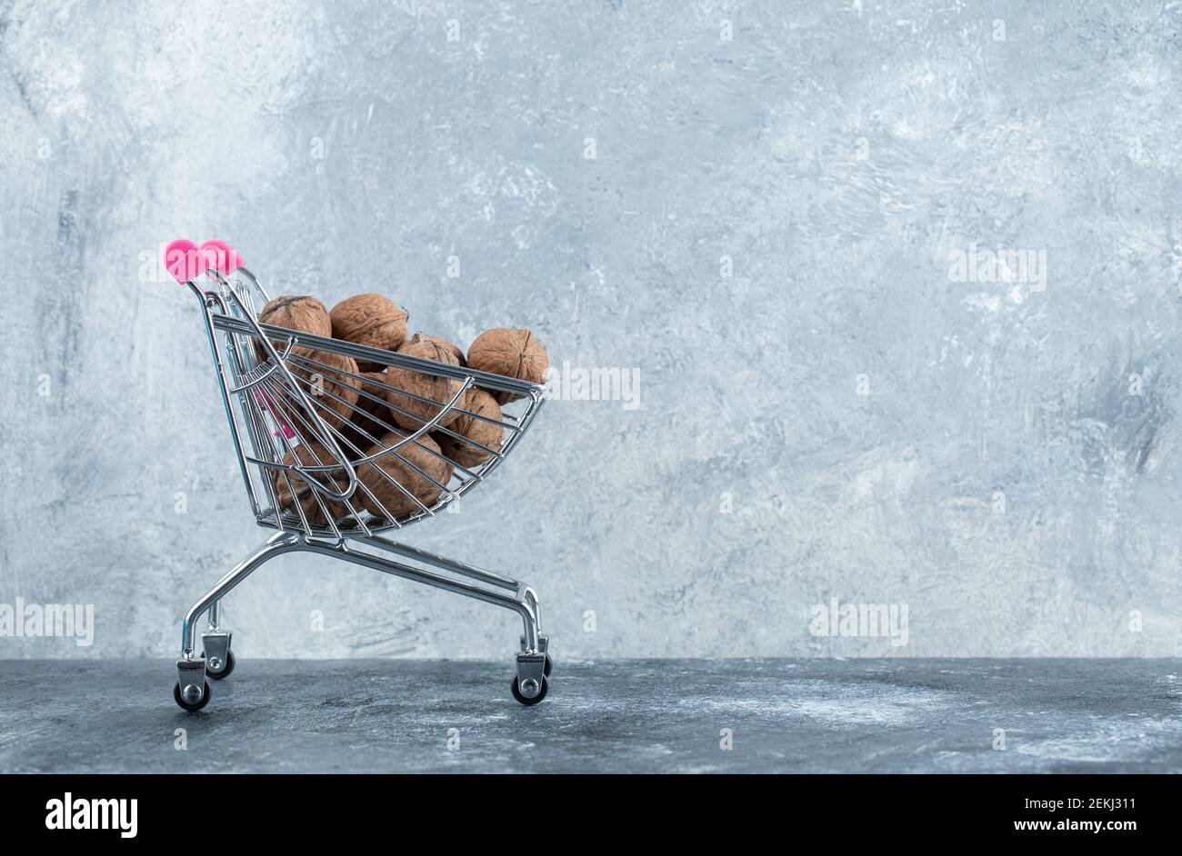 Pile of fresh walnuts in small market basket Stock Photo Alamy