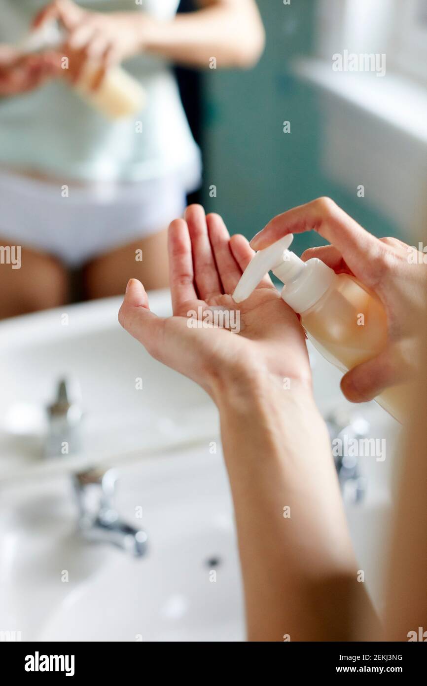 Woman washing her hands Stock Photo