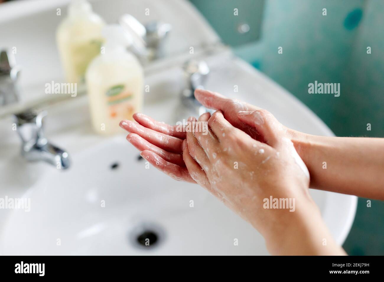 Woman washing her hands Stock Photo - Alamy