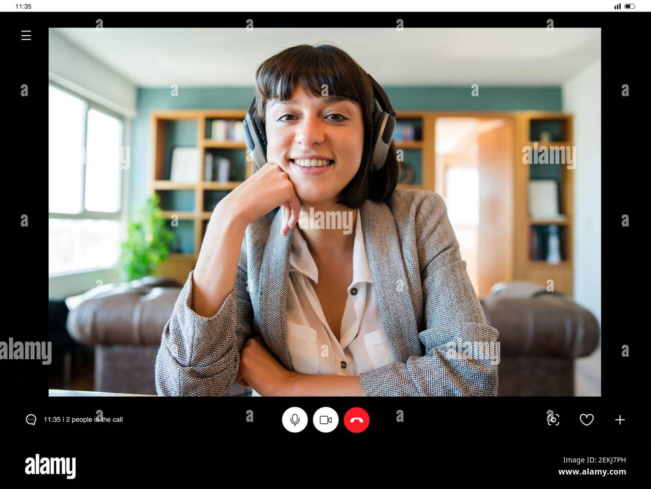 Business woman on a video call with headphones Stock Photo - Alamy