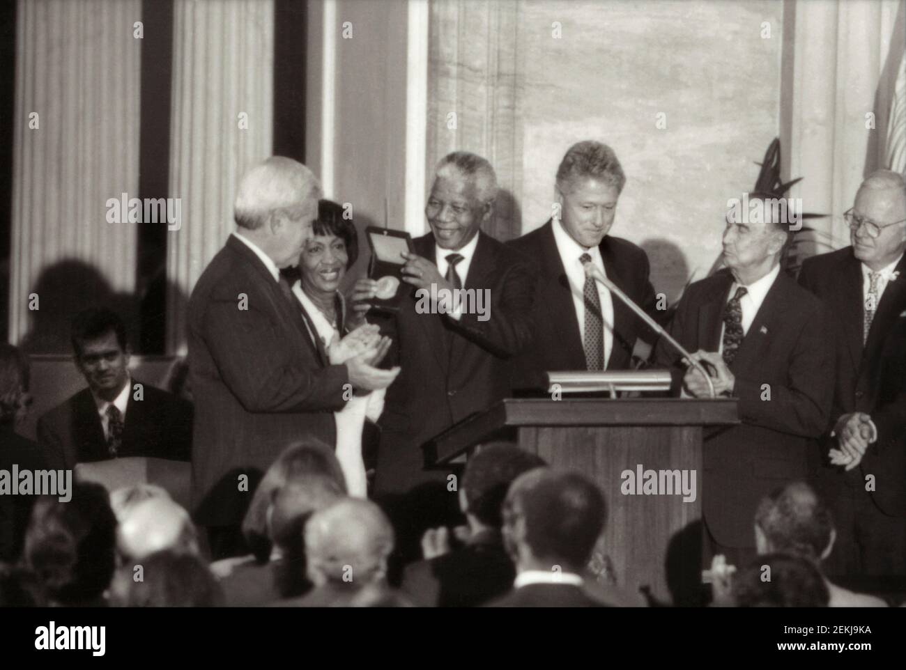 Nelson Mandela receiving Congressional Gold Medal from U.S. President Clinton, as Speaker of the House Newt Gingrich, Senator Strom Thurmond, Congresswoman Maxine Waters and others look on, Washington, D.C., USA, Rebecca Roth, September 23, 1998 Stock Photo