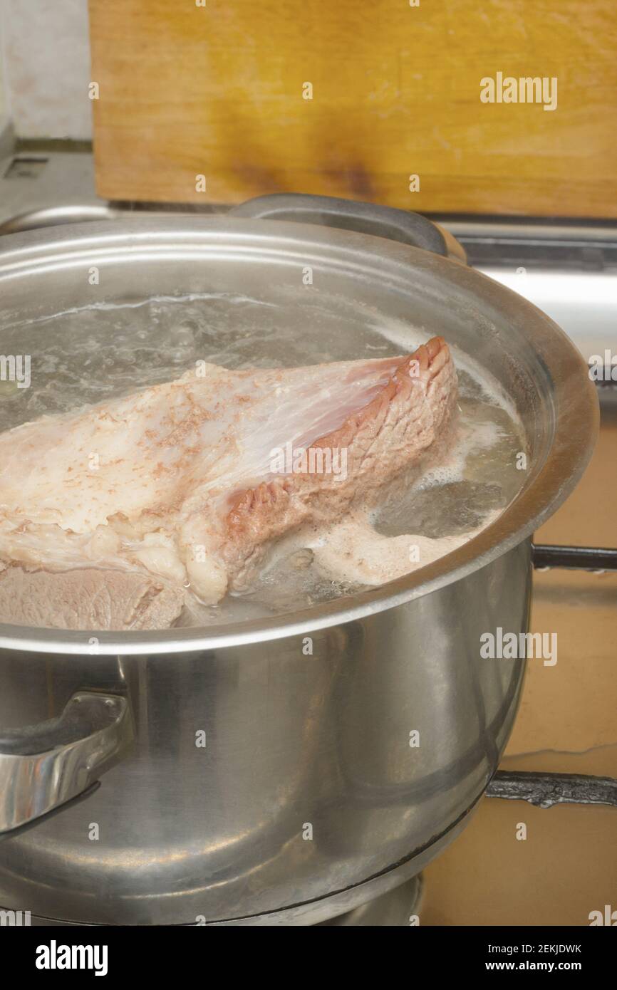 https://c8.alamy.com/comp/2EKJDWK/piece-of-pork-meat-is-cooked-in-fat-boiling-broth-pot-on-gas-stove-close-up-cooking-at-home-selective-focus-2EKJDWK.jpg