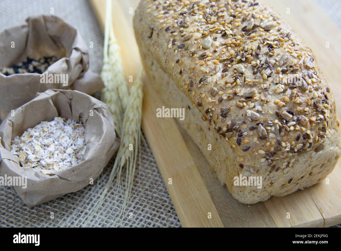 Plain bread with ingredients over wood background. Stock Photo