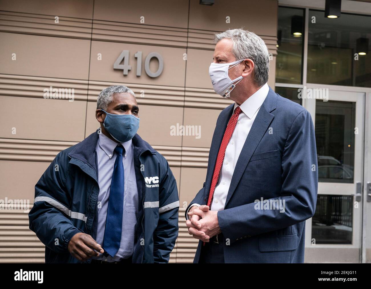 New York, United States. 23rd Feb, 2021. Mayor de Blasio and Commissioner of Department of Veterans Services James Hendon seen after celebrating 1000th veteran experiencing homelessness received own apartment at 410 Grand street in New York on February 23, 2021. Army Veteran Jocelyn Miller (not pictured) became the 1,000th veteran moved by the NYC Department of Veterans Services into her new one-bedroom apartment. (Photo by Lev Radin/Sipa USA) Credit: Sipa USA/Alamy Live News Stock Photo