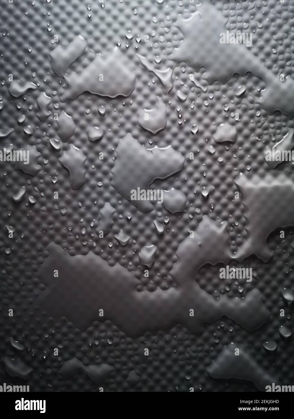 Splashes of water on shower tray highlighted in color Stock Photo Alamy