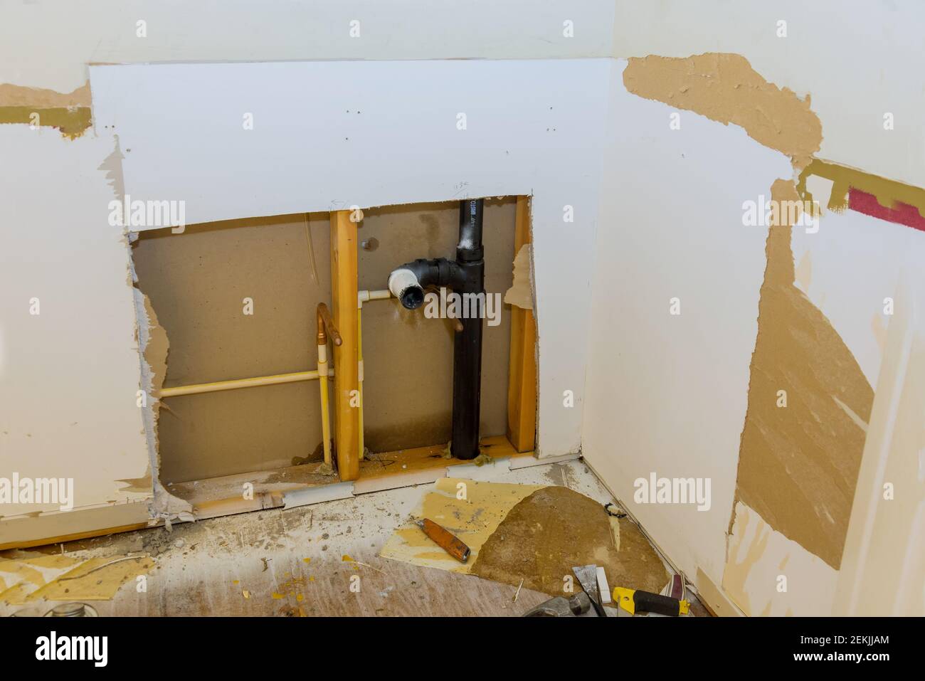 Repair of plastic polypropylene water pipes in hole in wall in