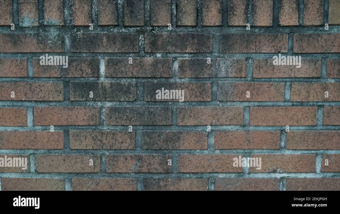 Dirty Red Brick Wall on the Street Stock Photo - Alamy
